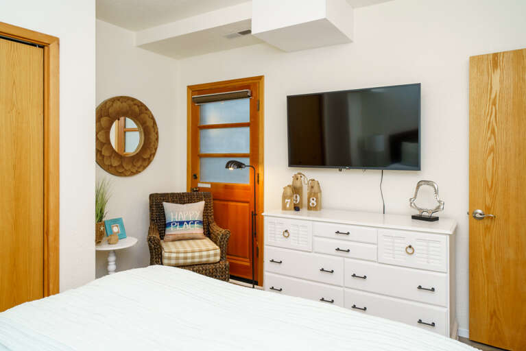 Downstairs queen bedroom with flat screen TV -Pack and Play in closet