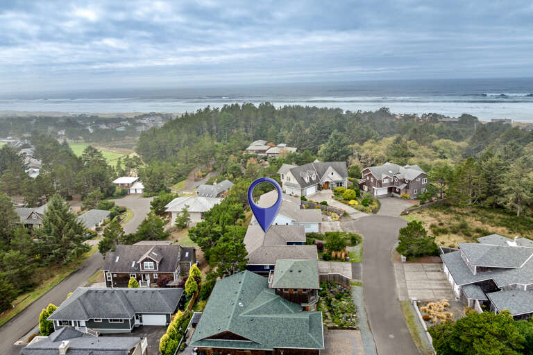 Aerial view of location in golf course neighborhood.