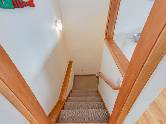 Stairs to Downstairs game room, bunk bedroom and full bath. 