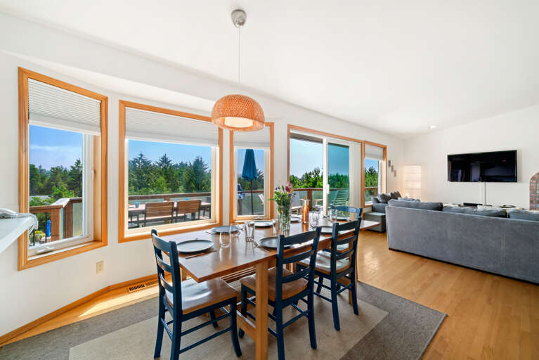 First floor with 3 bedrooms, kitchen, dining, living area, and access to outdoor space and garage. 
Living room with pellet stove, streaming TV. Kitchen with lots of counter space and storage. 