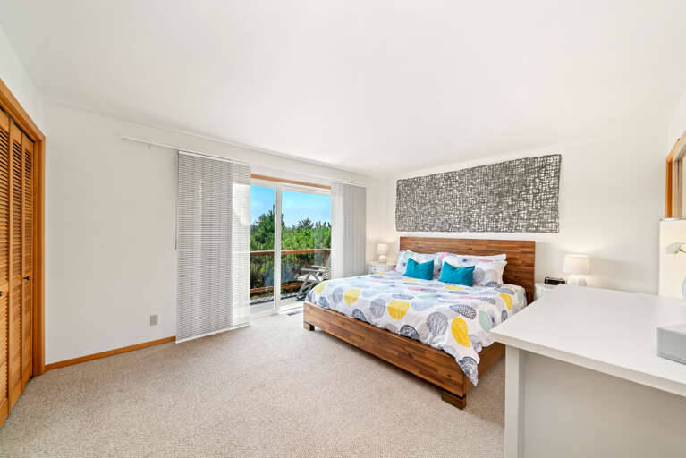 Master King bedroom with access to balcony and private full bath 