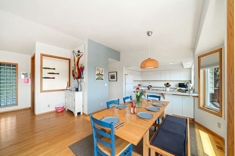 First floor with 3 bedrooms, kitchen, dining, living area, and access to outdoor space and garage. 
Living room with pellet stove, streaming TV. Kitchen with lots of counter space and storage. 