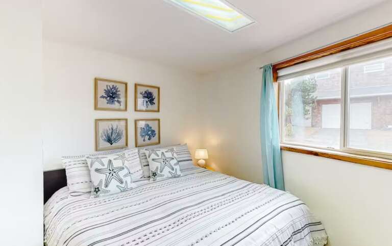 Downstairs King bed with sitting area.