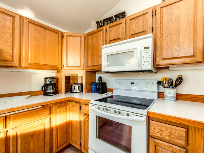Fully equipped kitchen open to the dining room. 