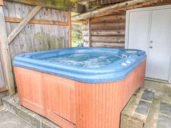 Hot tub just below the deck. 