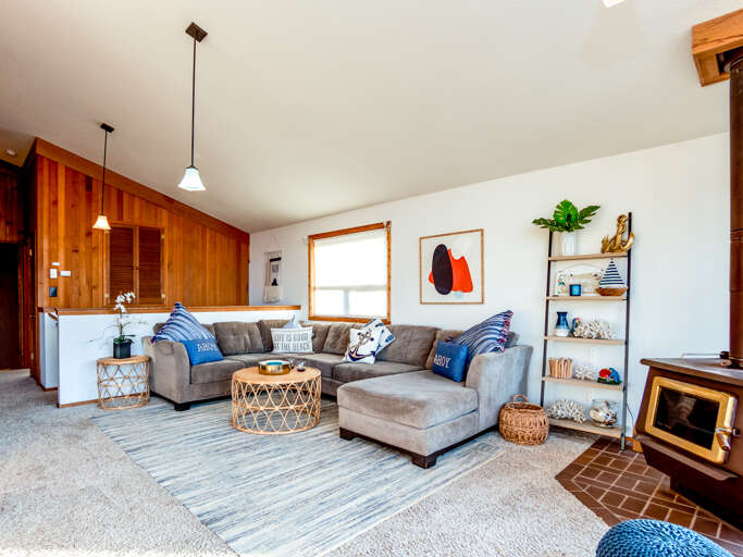Across the street from the beach. OCEAN VIEW Open dining and living space.Table seats 8-10,  Woodstove, Smart TV for Streaming, large couch.