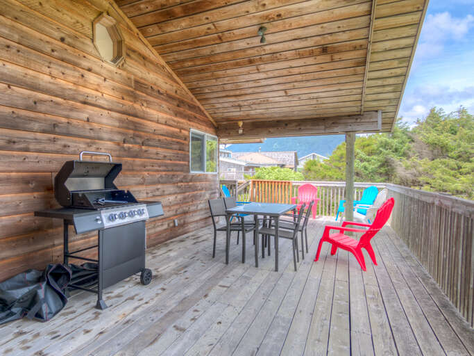 Gas BBQ and covered deck for outdoor dining. 