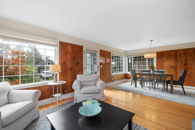 Living Room open to Dining room with Dish TV, Wifi, books.  Living Room open to Dining room with Dish TV, Wifi, books.