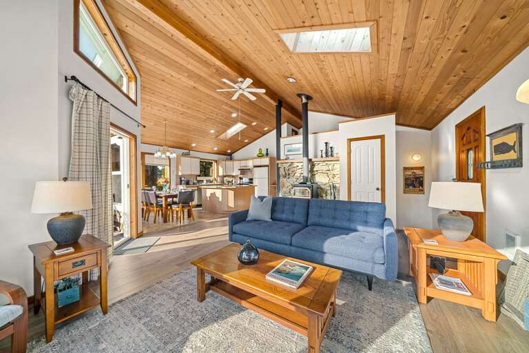 Upstairs open living area with access to the deck. Woodstove, Smart TV, WIFI, DVD, Books
