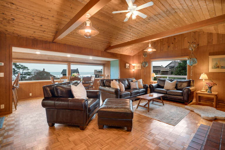 Living room with Cable TV, Electric fireplace, and Ocean views