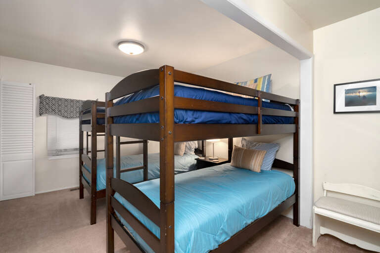 Bunk room with 2 bunks, 1/2 bath with toilet and sink, 1/2 bath with Shower, Cable TV. 