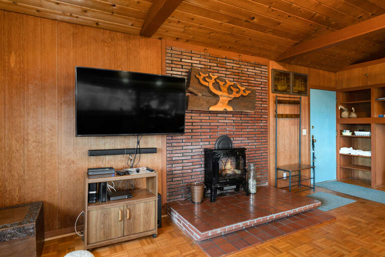 Living room with Cable TV, Electric fireplace, and Ocean views