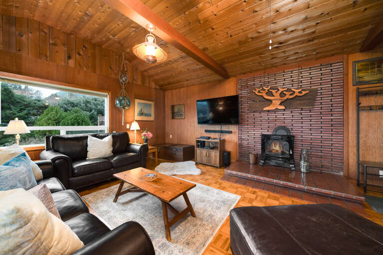 Living room with Cable TV, Electric fireplace, and Ocean views