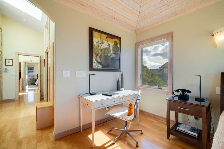 Master Bedroom with spectacular ocean views, gas fireplace, luxury linens, overhead fans, desk workspace. attached master bath with Jacuzzi tub, double sinks, nespresso coffee station. 