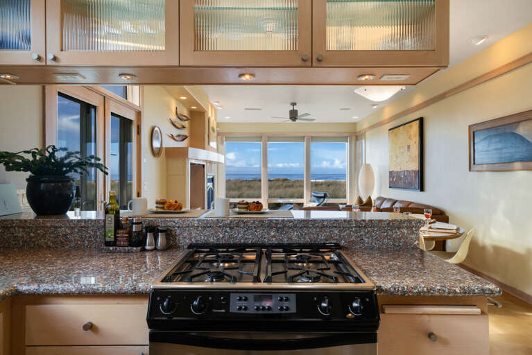 Fully equipped kitchen, well stocked for the chef in the family. With breakfast bar for 3 and ocean views. 