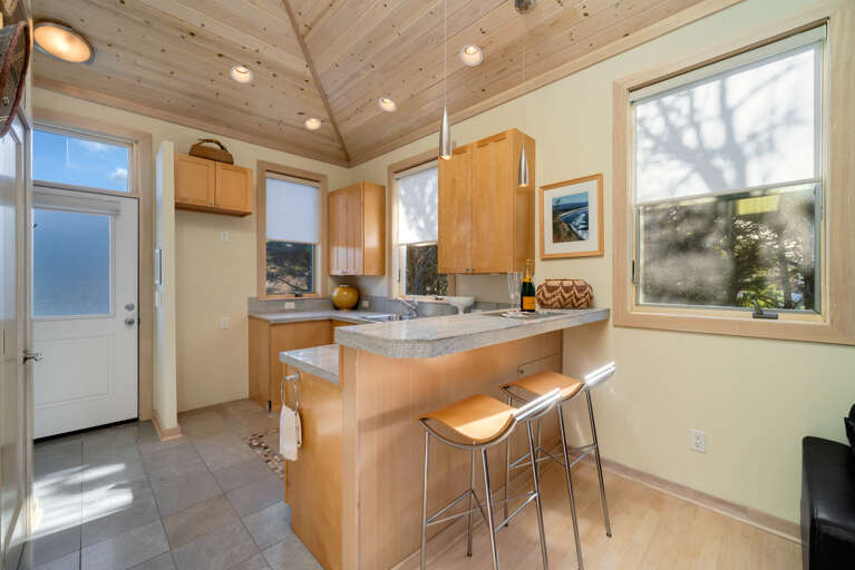 Separate Cabana studio apartment with Queen murphy bed, Direct TV, Gas fireplace, Wet bar, Full bath with shower, breakfast bar for 2. 