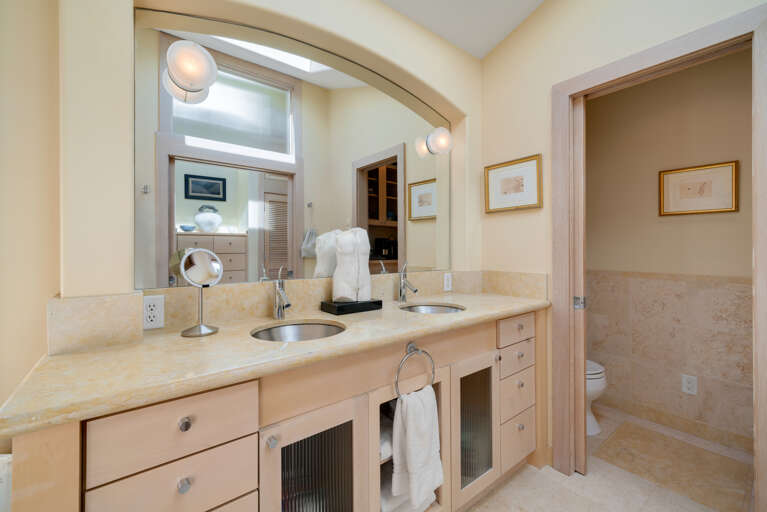 Master Bedroom with spectacular ocean views, gas fireplace, luxury linens, overhead fans, desk workspace. attached master bath with Jacuzzi tub, double sinks, Nespresso coffee station. 