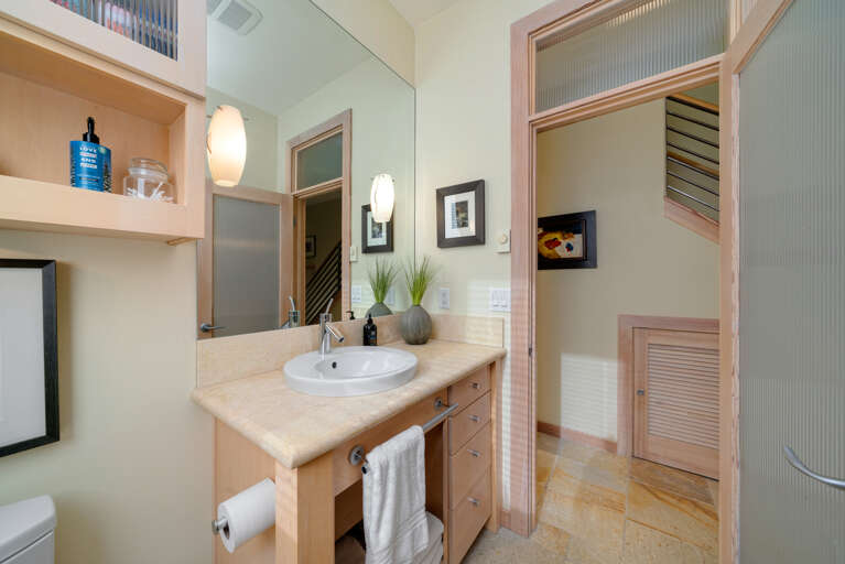 Downstairs full bath with Walk-in Shower and Stackable Washer and Dryer. 