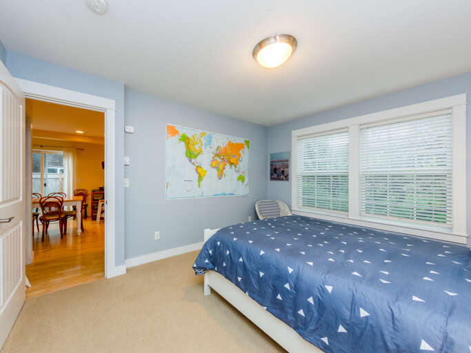 Downstairs master bedroom with queen bed and attached bath with jetted tub.