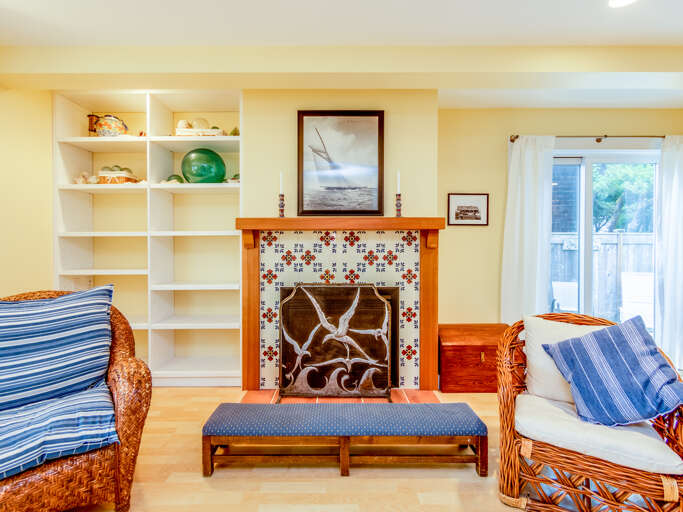 Living room with gas fireplace, streaming TV, DVD player.