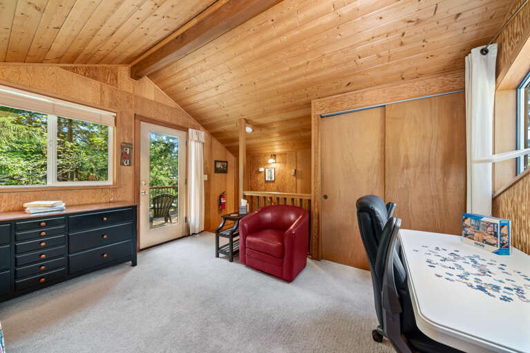 Loft space with futon, desk space and access to upper private deck