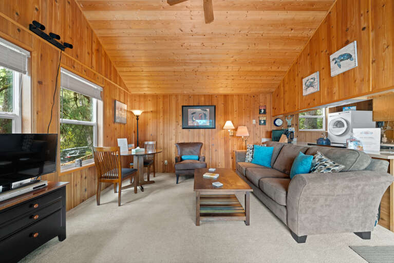 Living room with woodstove, streaming TV, DVD player. 