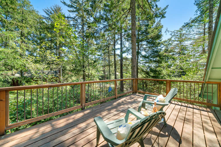 Upper private deck off of loft room with desk and futon. 