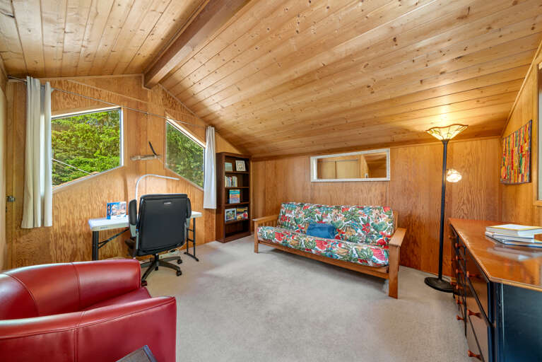 Loft with desk and futon. With access to upper back private deck. 