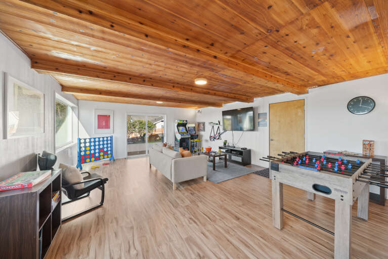 Game room with Arcade games, atari, Xbox, guitar hero, foosball, big connect four and more