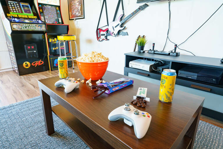 Game room with Arcade games, atari, Xbox, guitar hero, foosball, big connect four and more