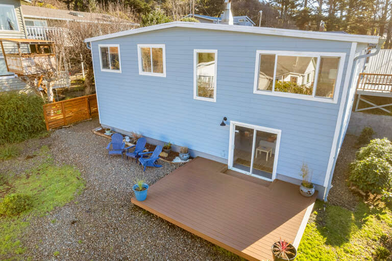 Newly fenced in back yard for your pup with deck