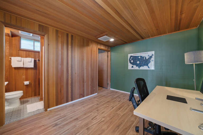 Downstairs office space with large deck and private bath. 