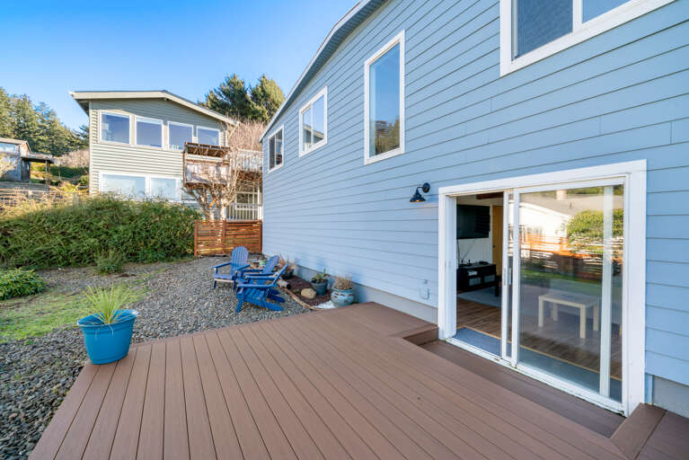 Newly fenced in back yard for your pup with deck