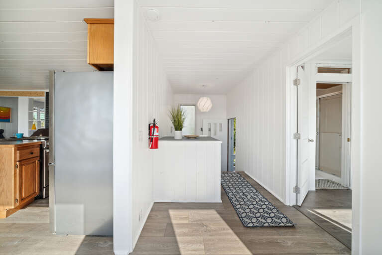 Entry and Hall way to lower level stairs.