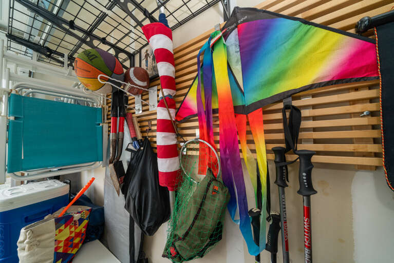 Garage game room with streaming tv, lounge area, airhockey, card table, bikes (not maintained by STS) and beach toys