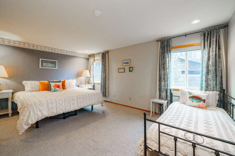 Main floor bedroom with Craftmatic adjustable King bed and twin daybed