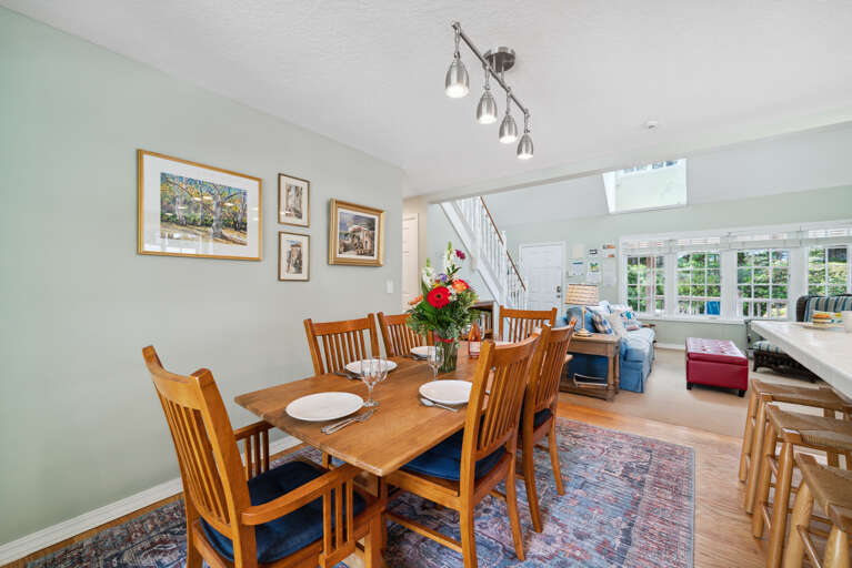 Fully equipped kitchen, and dining area. Door out to the back yard area. 