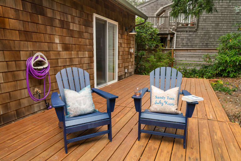 Back yard deck with outdoor dining table, Gas BBQ, lounging chairs. 