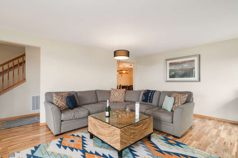 Main floor living room with fireplace, ocean view, Roku w/live TV, DVD player, books, games. 