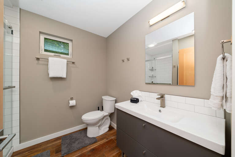 Main floor bath with walk in shower/stackable washer and dryer.