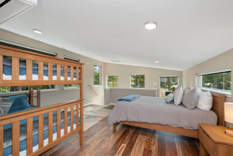  Family suite bedroom with Queen and double bunk beds with private bath with shower/tub combo. Office work space. Electric black out blinds.