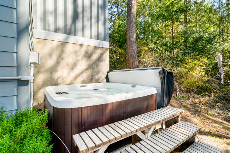Private hot tub in a wooded backyard area
