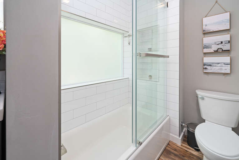  Family suite bedroom with Queen and double bunk beds with private bath with shower/tub combo. Office work space. Electric black out blinds.