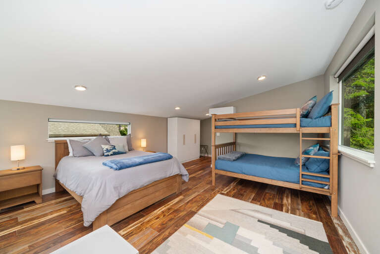  Family suite bedroom with Queen and double bunk beds with private bath with shower/tub combo. Office work space. Electric black out blinds.