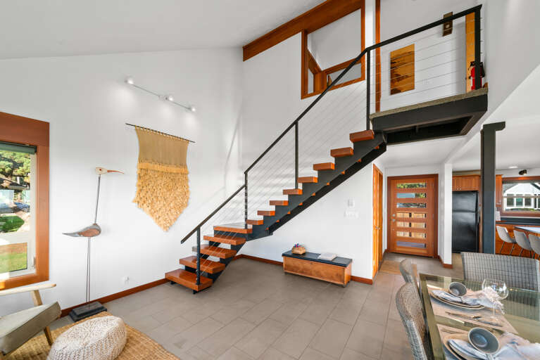 Stairs to upper level with 2 bedrooms, den room and full bath with walk in shower 