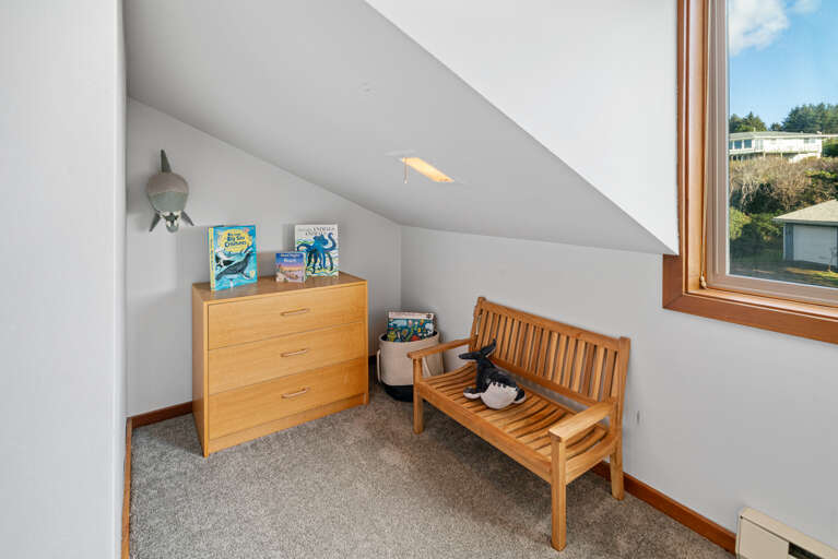 Den room with double hide-a-bed, kids play area, books and games. 