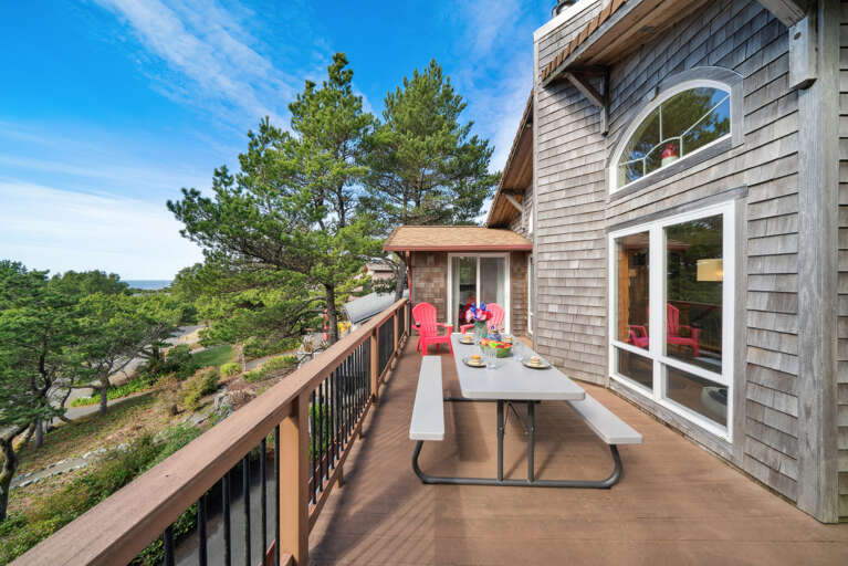 Upper deck with picnic table, adirondak chairs and Gas BBQ