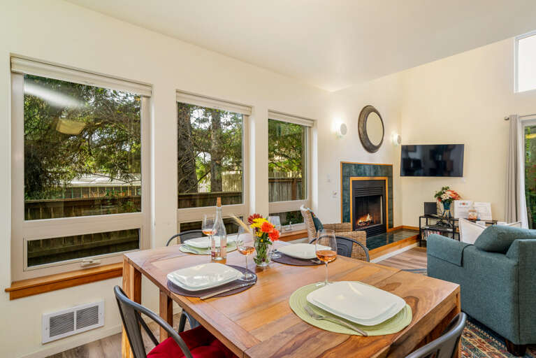 Dining room open to living room with fireplace, TV, queen sofa bed, full bath with walk in shower.  Dining room open to living room with fireplace, TV, queen sofa bed, full bath with walk in shower.