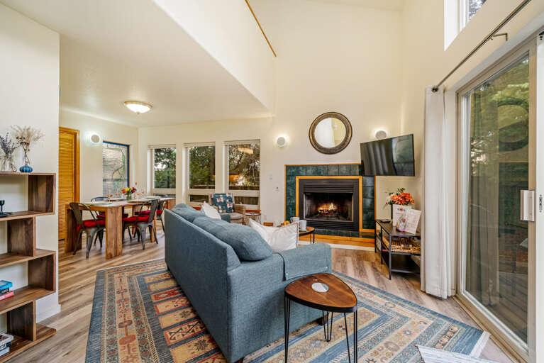 Living room with Gas Fireplace, TV, Queen sofa Sleeper, open to the dining area.  Living room with Gas Fireplace, TV, Queen sofa Sleeper, open to the dining area.