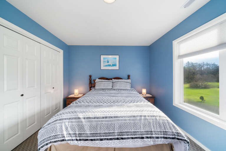 Upstairs queen bedroom with golf course view. 